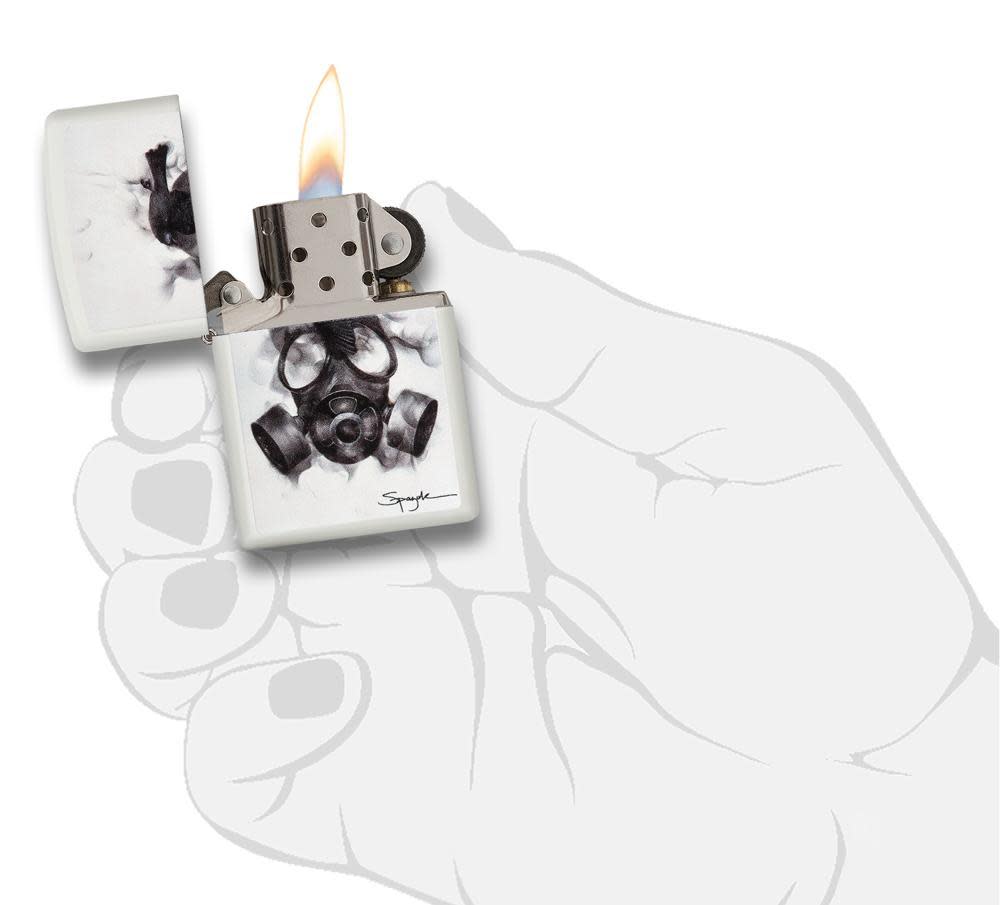 Front view of the Black Bird Resting on a Smoking Gas Mask, in hand,  open and lit